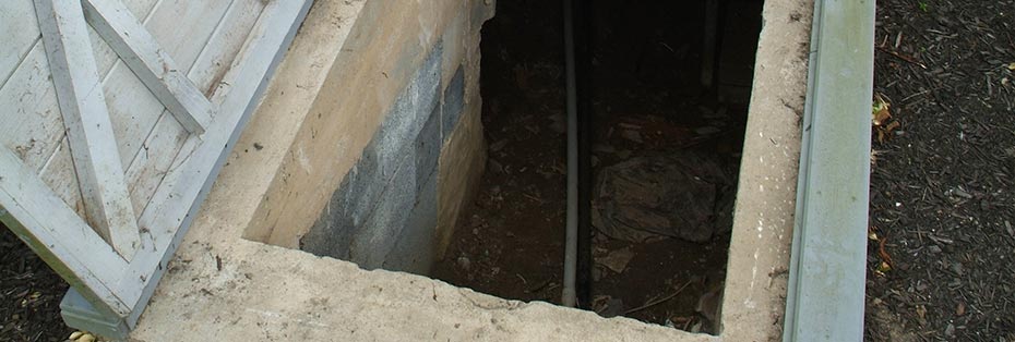 Crawl space access opening showing dry conditions and proper drainage beneath a West Virginia home.