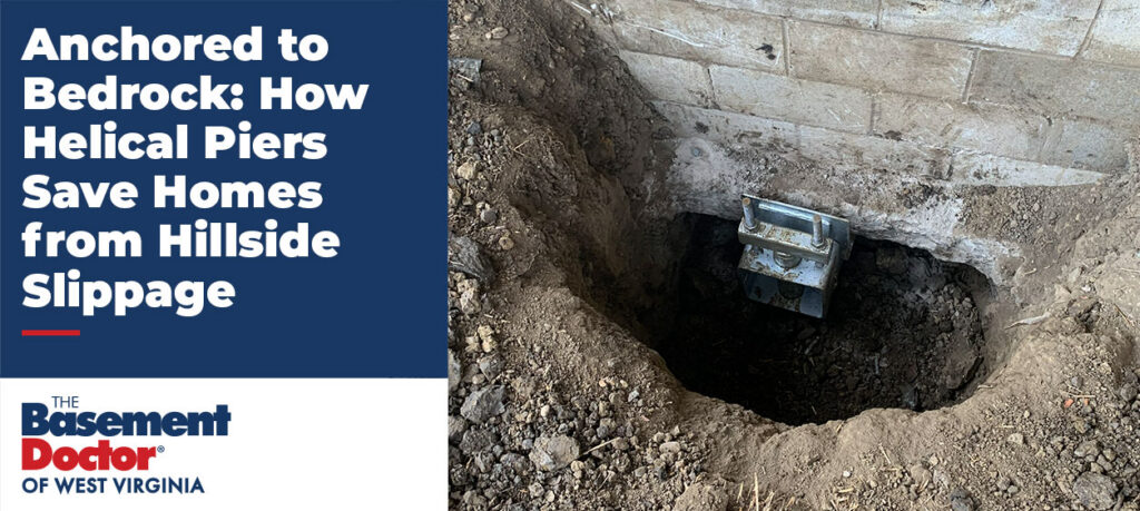 Helical pier foundation repair installation beside a home's concrete foundation, showing a steel support bracket anchored below grade to stabilize a hillside foundation in West Virginia.